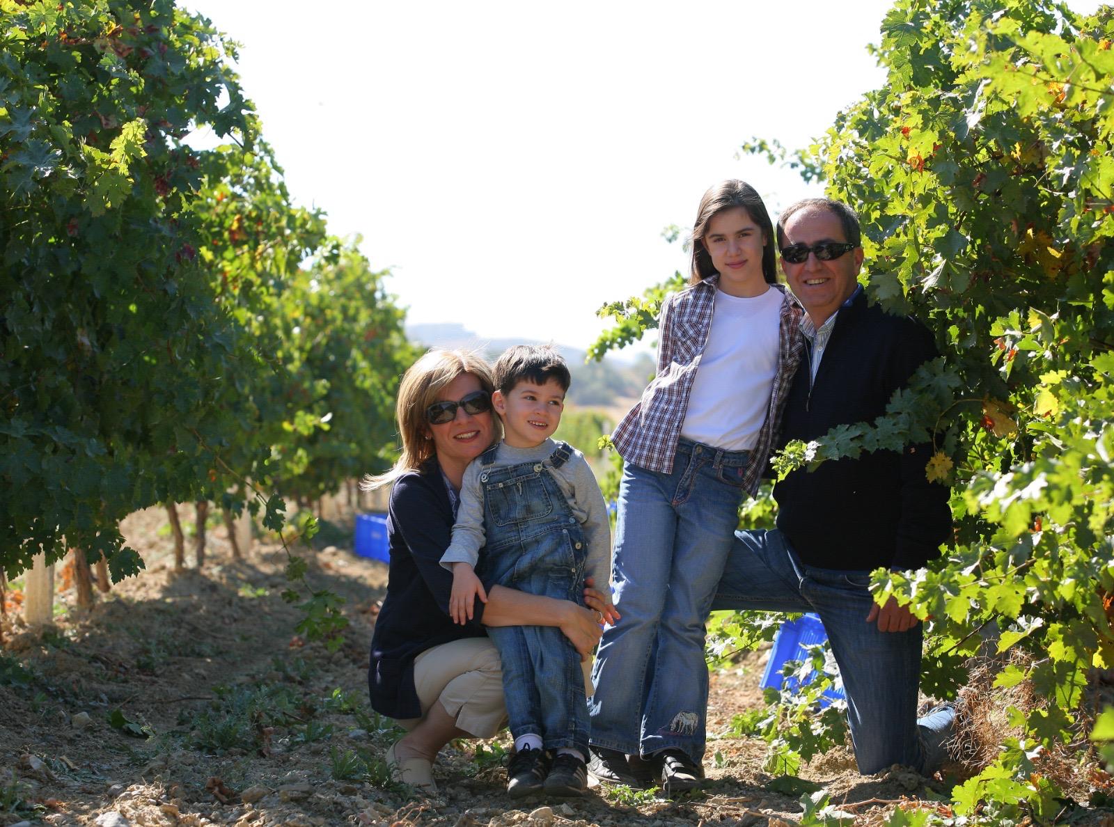 The Turasan family in the vineyard during harvest.